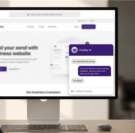 Desktop monitor with Chatley AI chat widget on a website