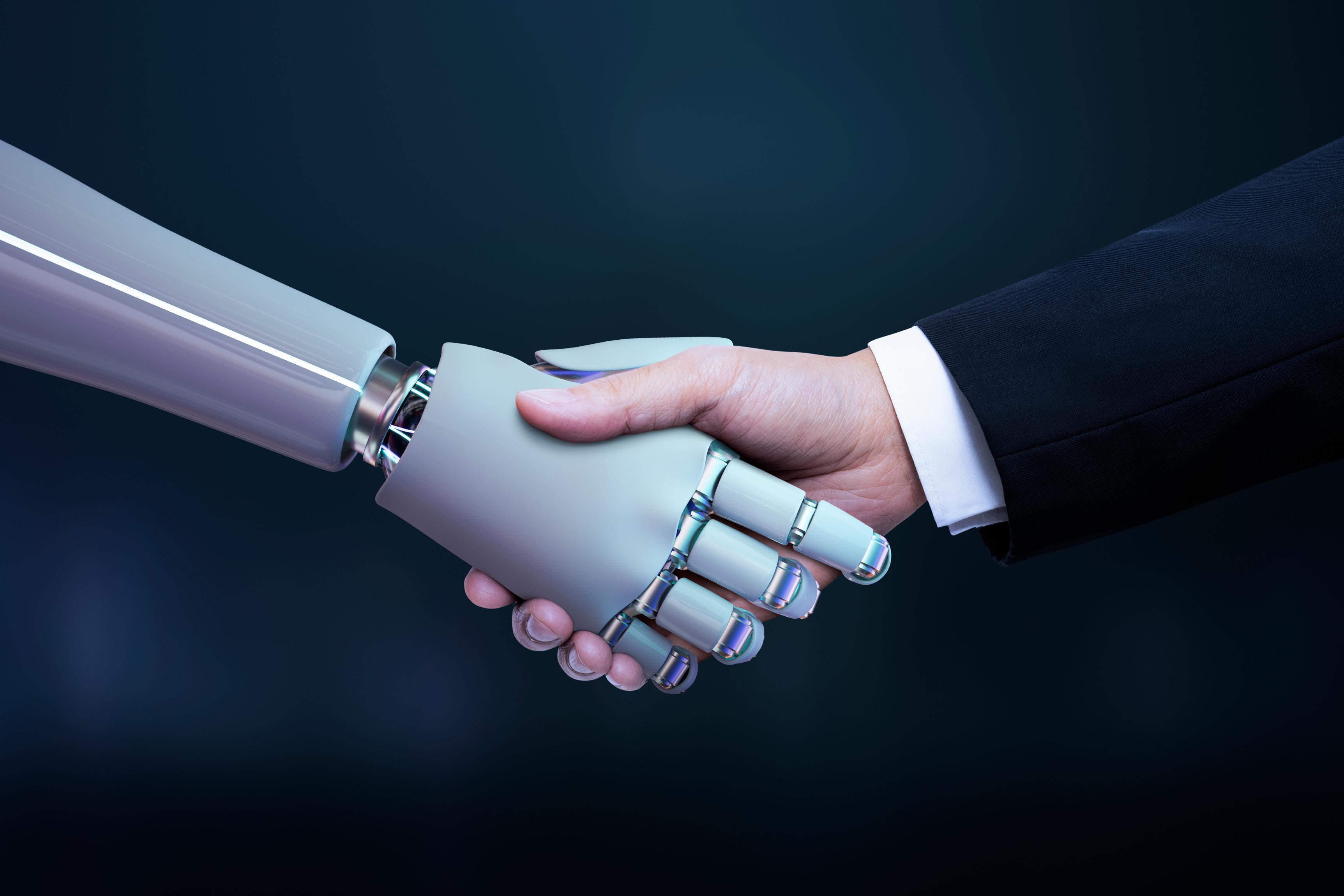 Human and robotic handshake — partnership and technology